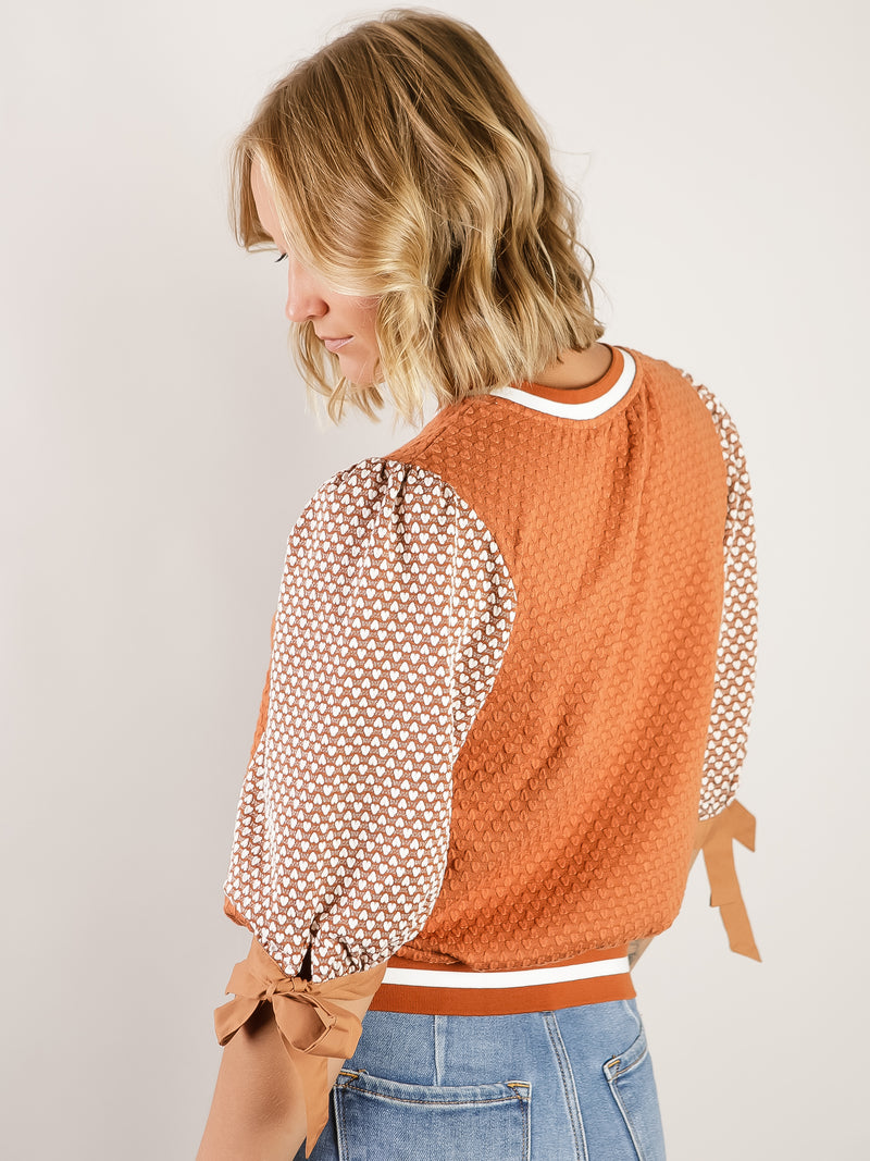 Rust Textured Print Top with Bow Sleeves